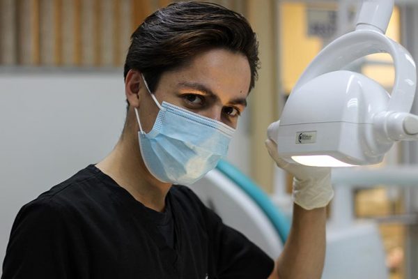 Male dentist in mask