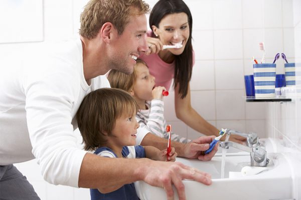 Family brushing teeth